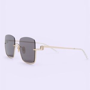 Gucci Gold Frame Sunglasses with Black Lenses